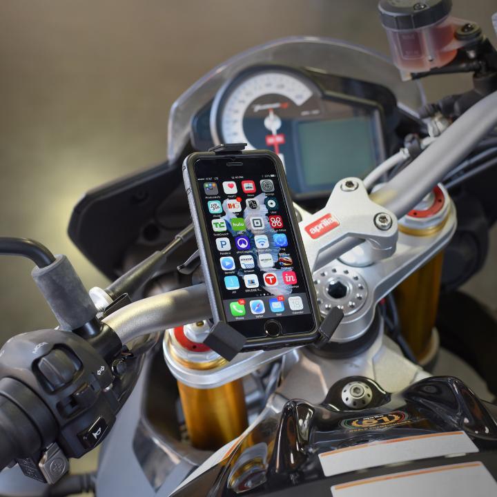 phone mounted to Mob Mount Switch Claw attached to motorcycle handlebar